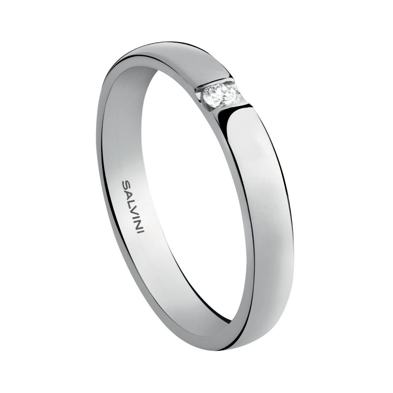 Fede nuziale in oro bianco con diamante.