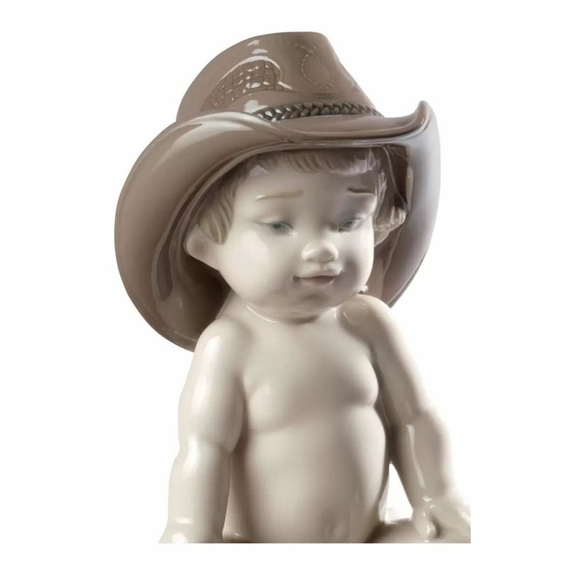 Figurina Bimbo con cappello da cowboy