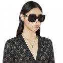 Collana con ciondolo G intrecciata in argento 925 invecchiato