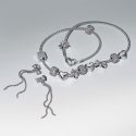 Orecchini Pendenti Fiocco Luminoso e Pavè a Cascata